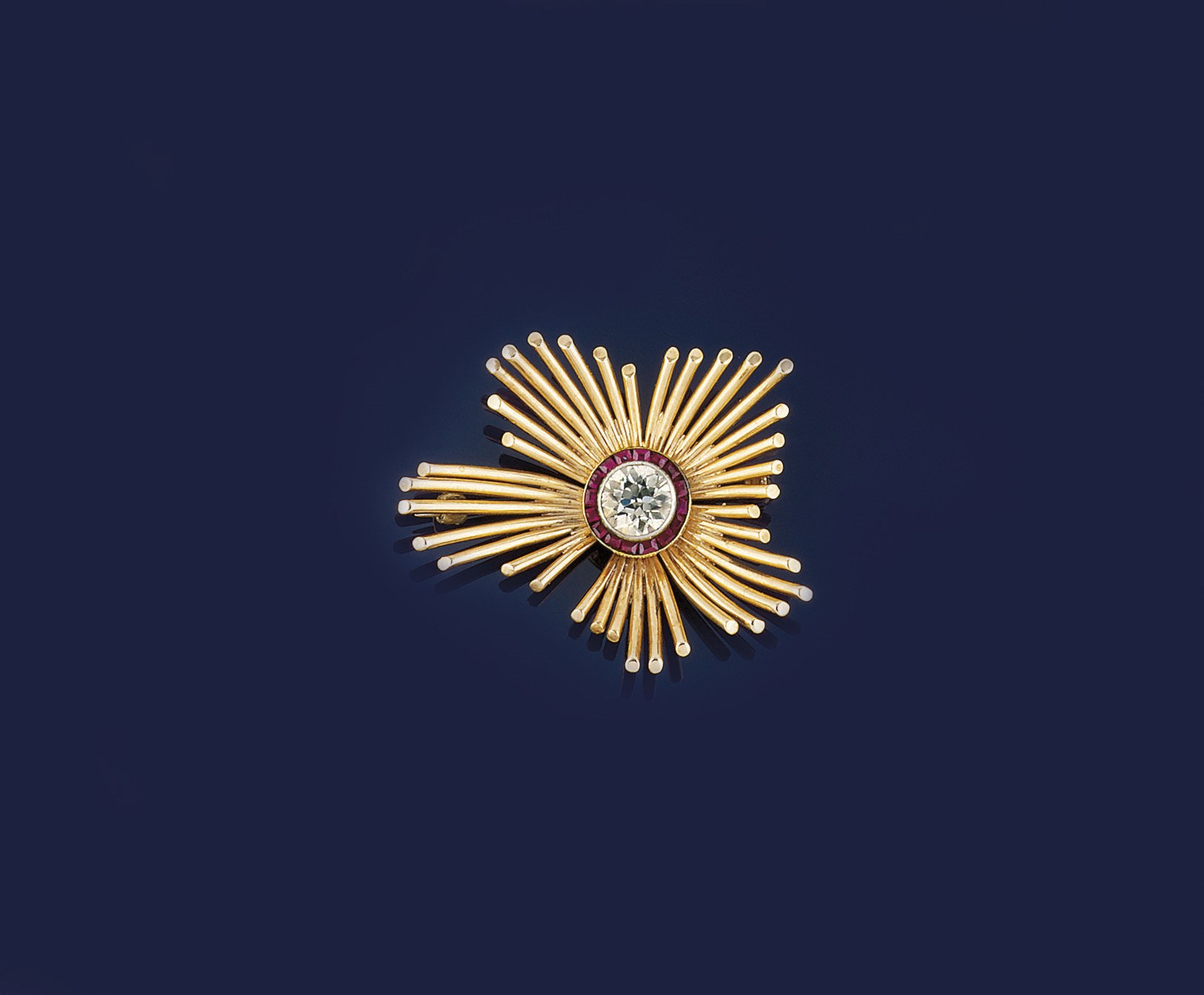 A GOLD, DIAMOND AND SYNTHETIC RUBY BROOCH