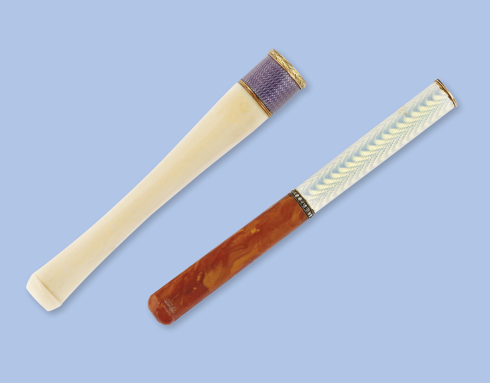 Two cigarette holders by Faberge