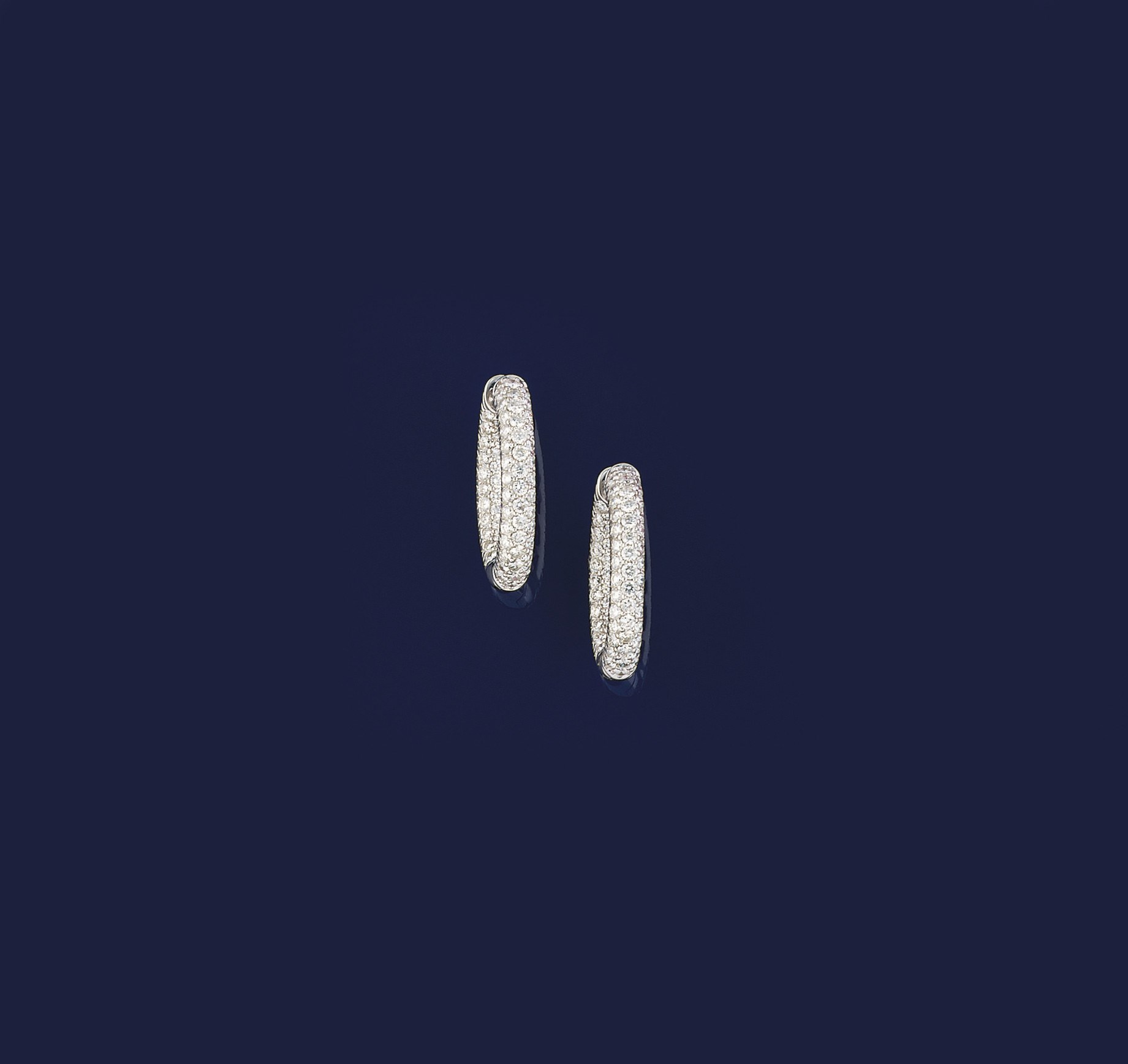 A PAIR OF DIAMOND EARRINGS