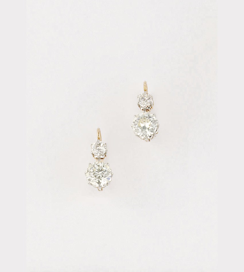 A pair of old brilliant-cut diamond two stone earrings