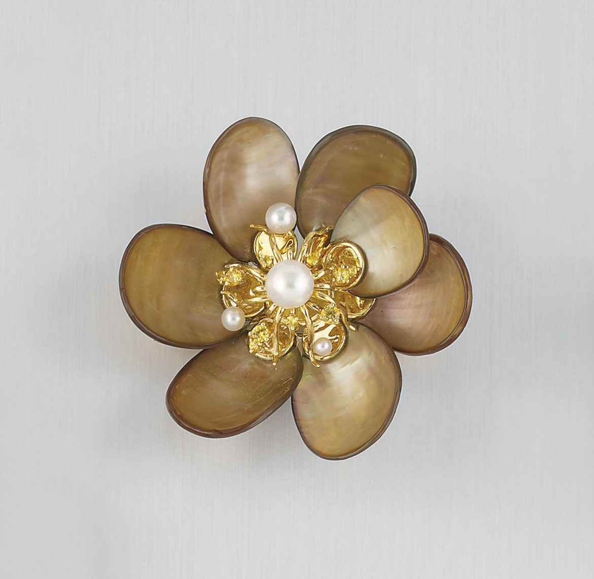 A MOTHER-OF-PEARL, CULTURED PEARL AND YELLOW SAPPHIRE FLOWERHEAD BROOCH, BY SEAMAN SCHEPPS