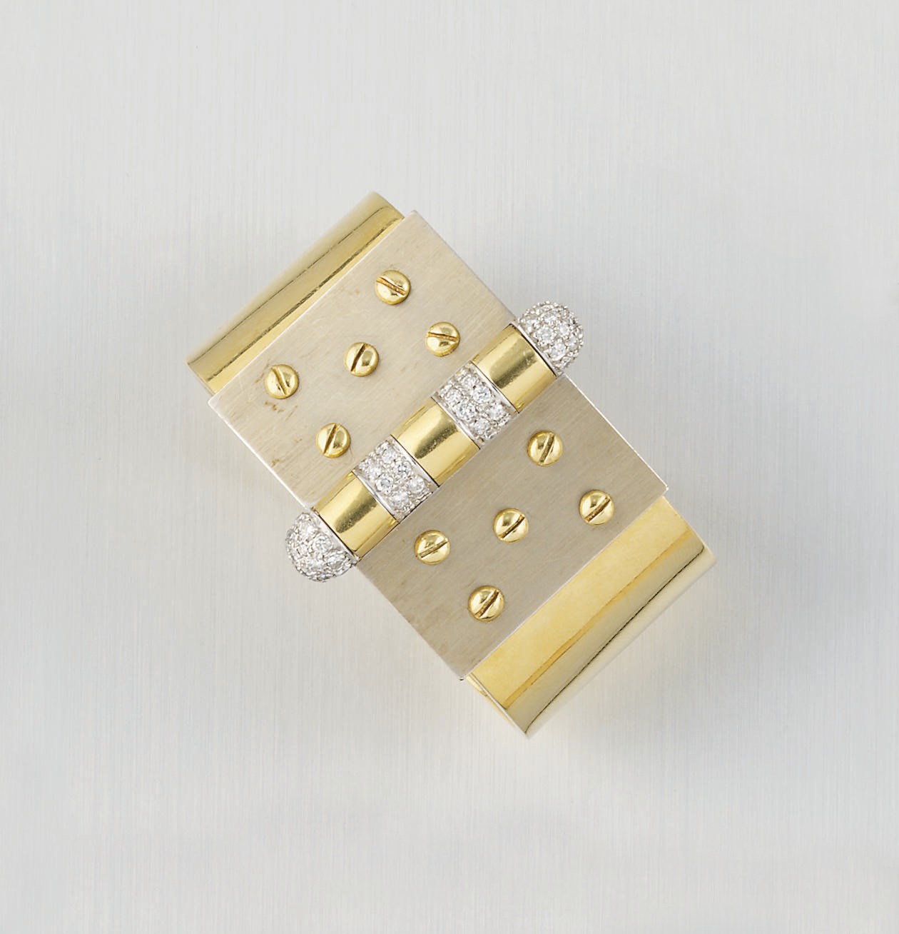 A DIAMOND SET TWO COLOUR BANGLE