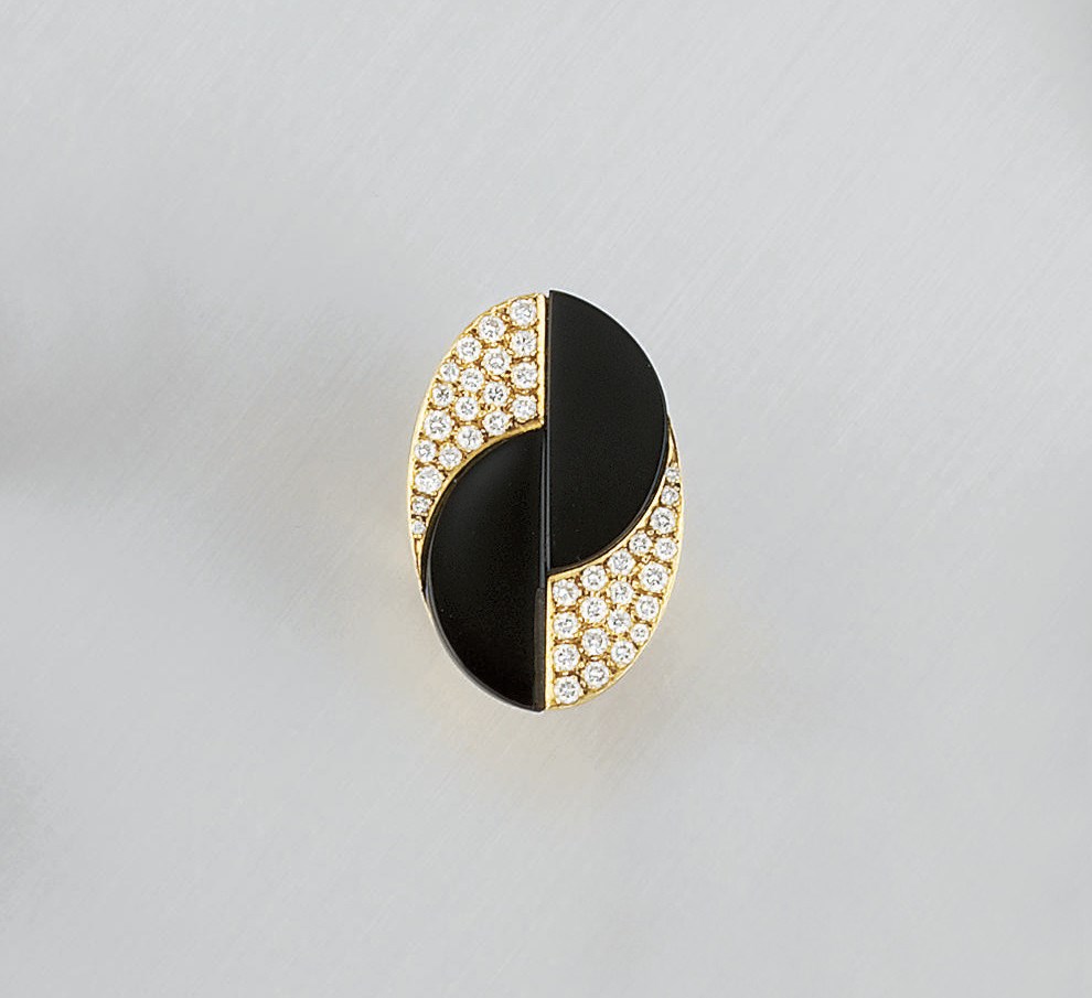 A diamond and onyx ring, by Tiffany & Co