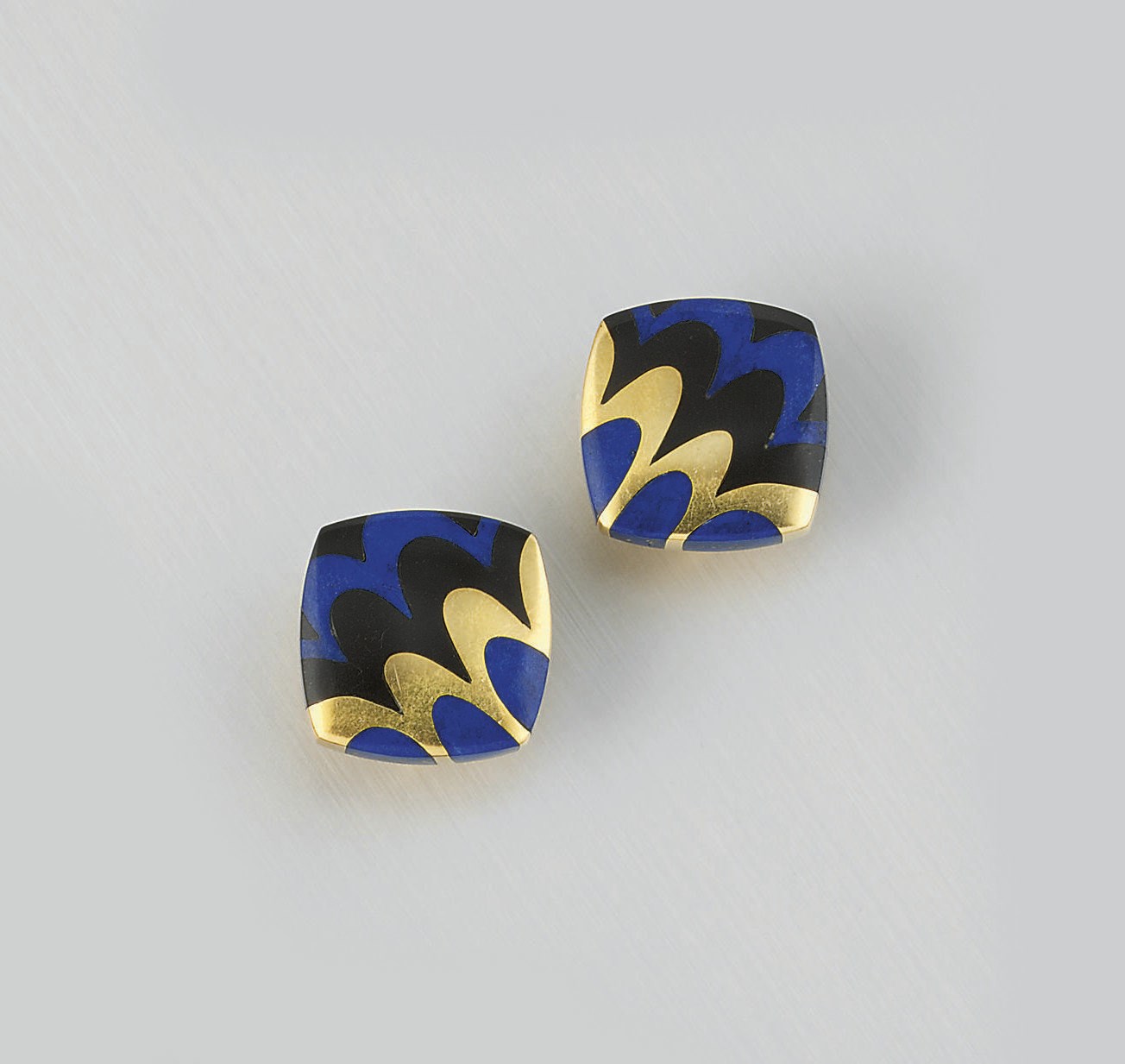 A pair lapis lazuli and onyx earclips by Tiffany & Co