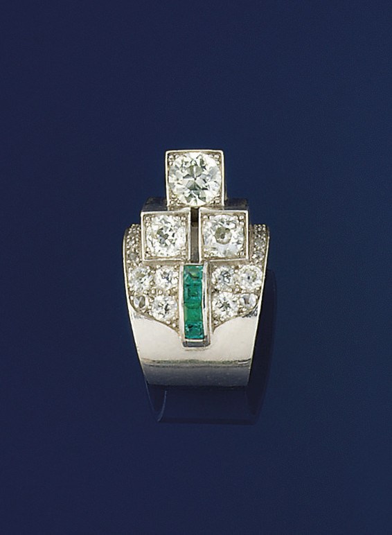 An Art Deco emerald and diamond cocktail ring
