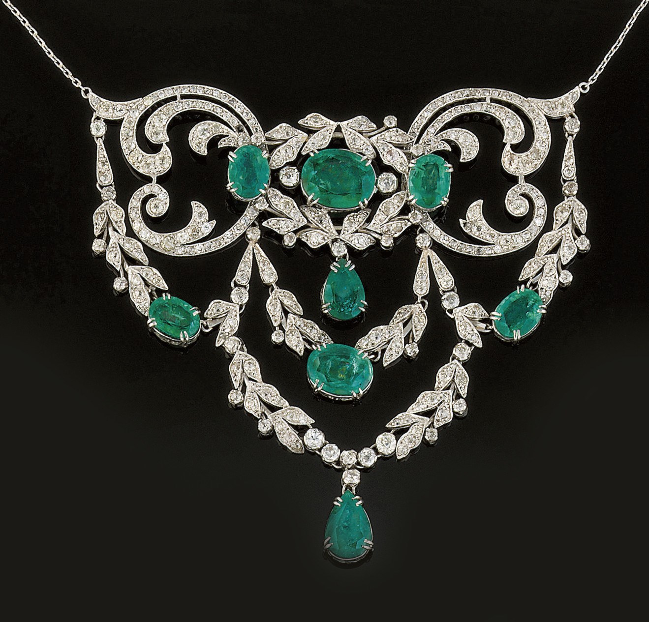 An early 20th century diamond and emerald necklace