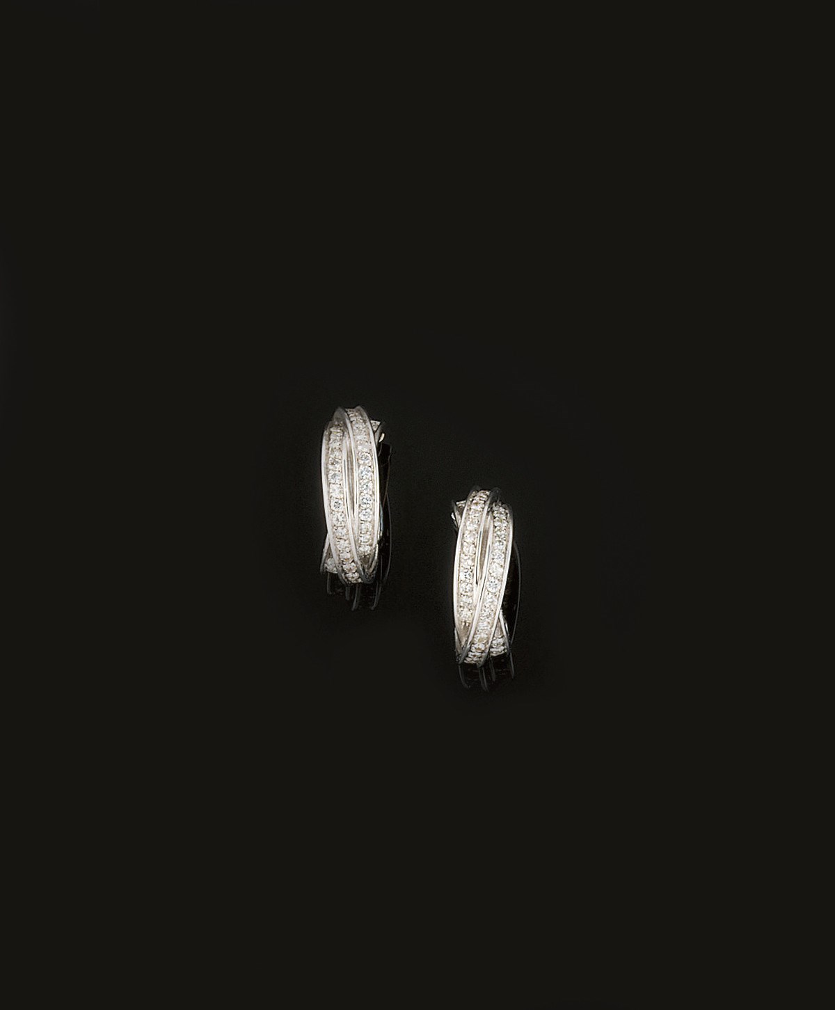 A pair of 18ct. gold and diamond earrings, by Cartier