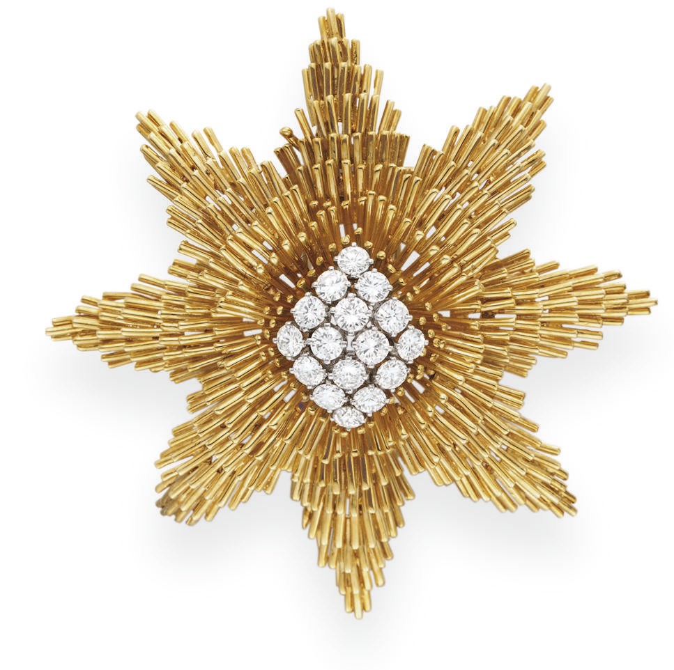 A DIAMOND AND GOLD STAR BROOCH, BY DAVID WEBB
