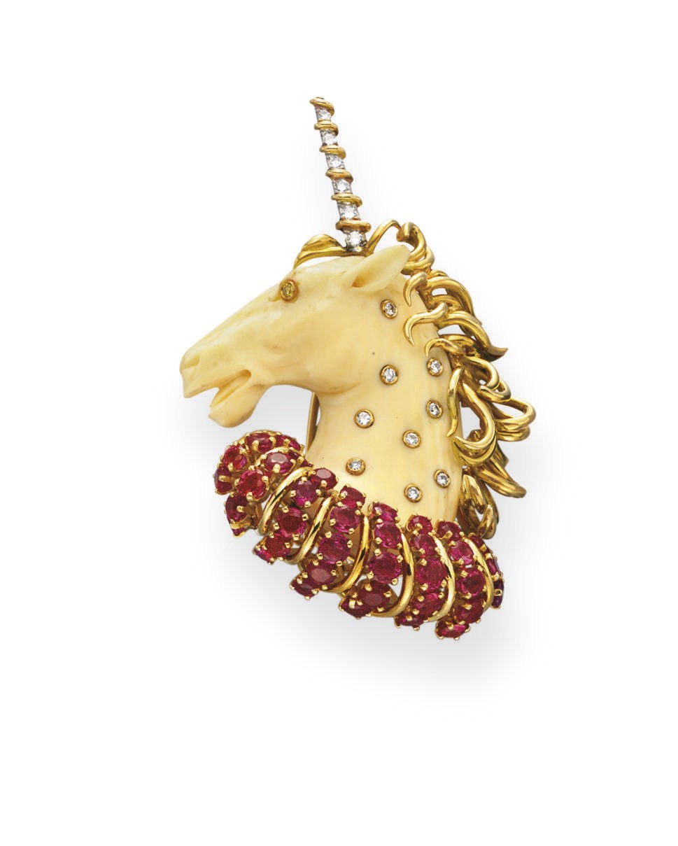 **AN IVORY, RUBY AND DIAMOND UNICORN BROOCH