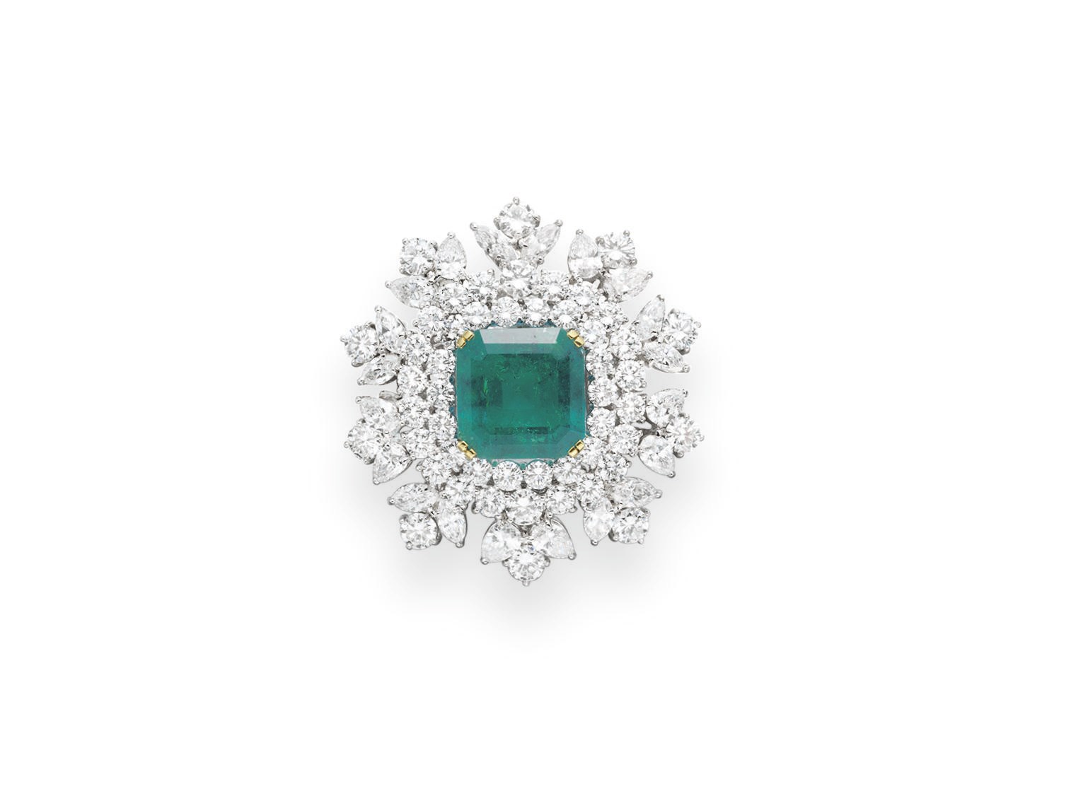 AN EMERALD AND DIAMOND BROOCH