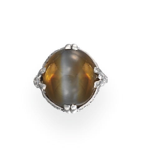 AN ART DECO CAT'S EYE CHRYSOBERYL AND DIAMOND RING, BY WALTON & CO.