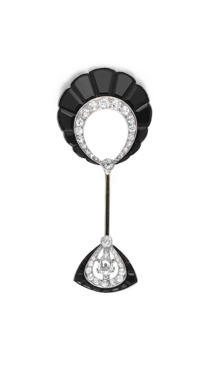 AN ART DECO ONYX AND DIAMOND JABOT PIN