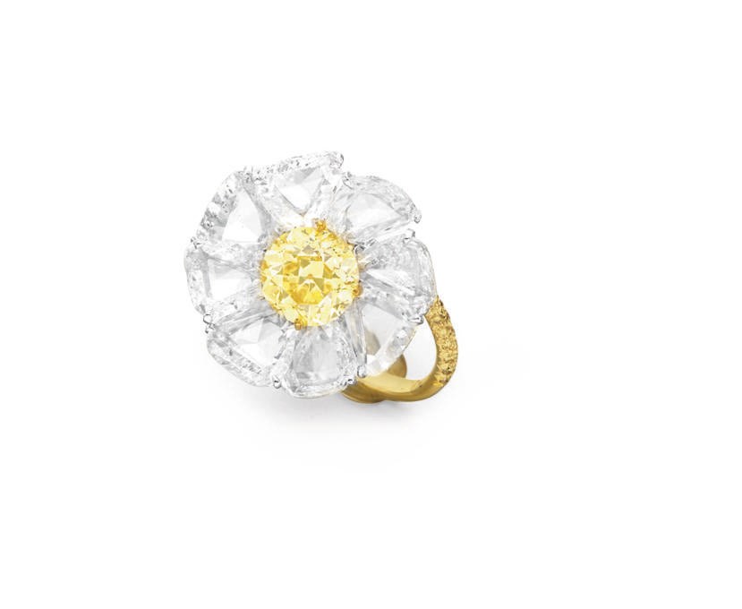 AN ELEGANT COLORED DIAMOND FLOWER RING, BY BHAGAT