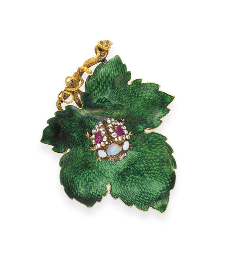 AN ANTIQUE ENAMEL AND MULTI-GEM BROOCH