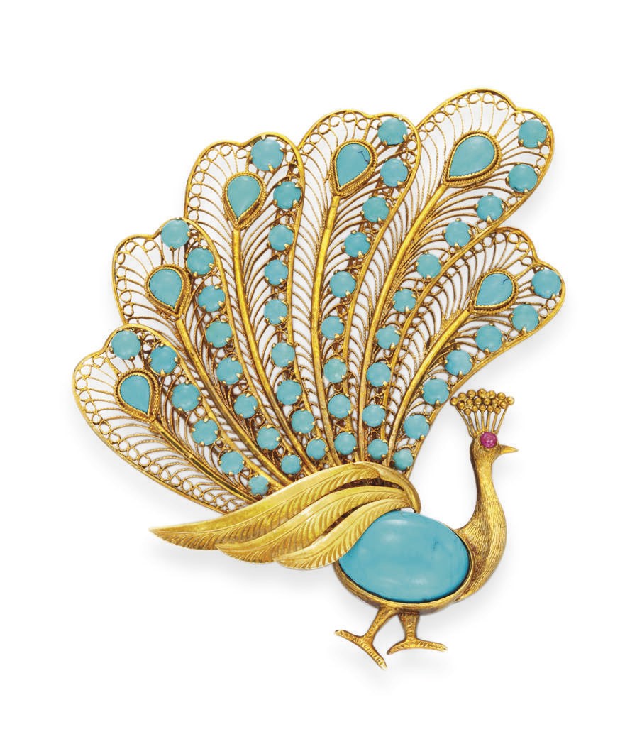 A TURQUOISE AND GOLD PEACOCK BROOCH