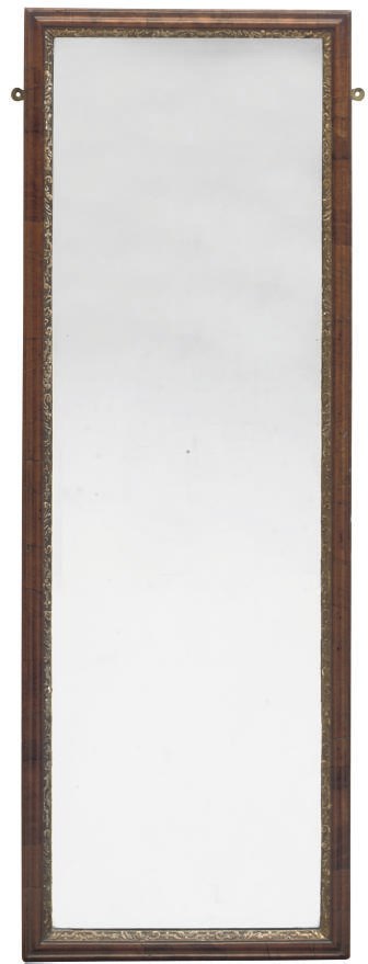 A WALNUT AND PARCEL GILT RECTANGULAR MIRROR