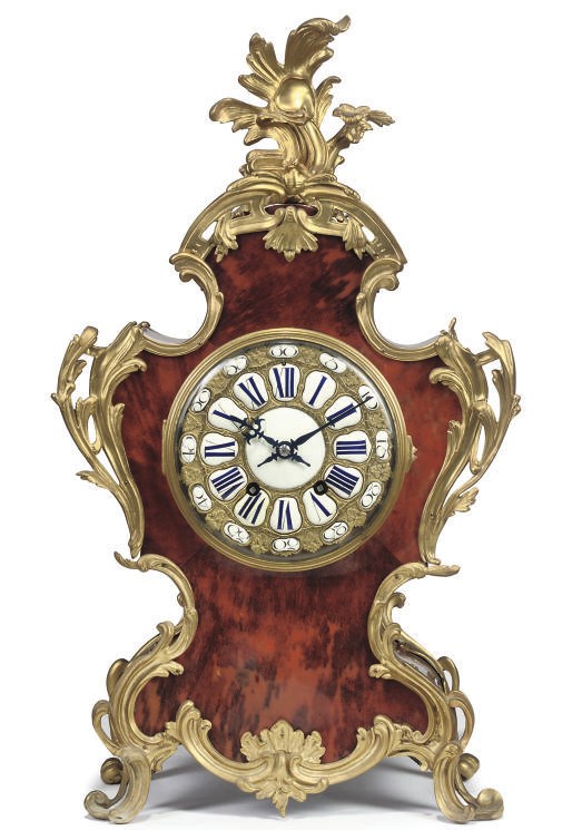 A GILT METAL MOUNTED AND TORTOISESHELL BRACKET CLOCK