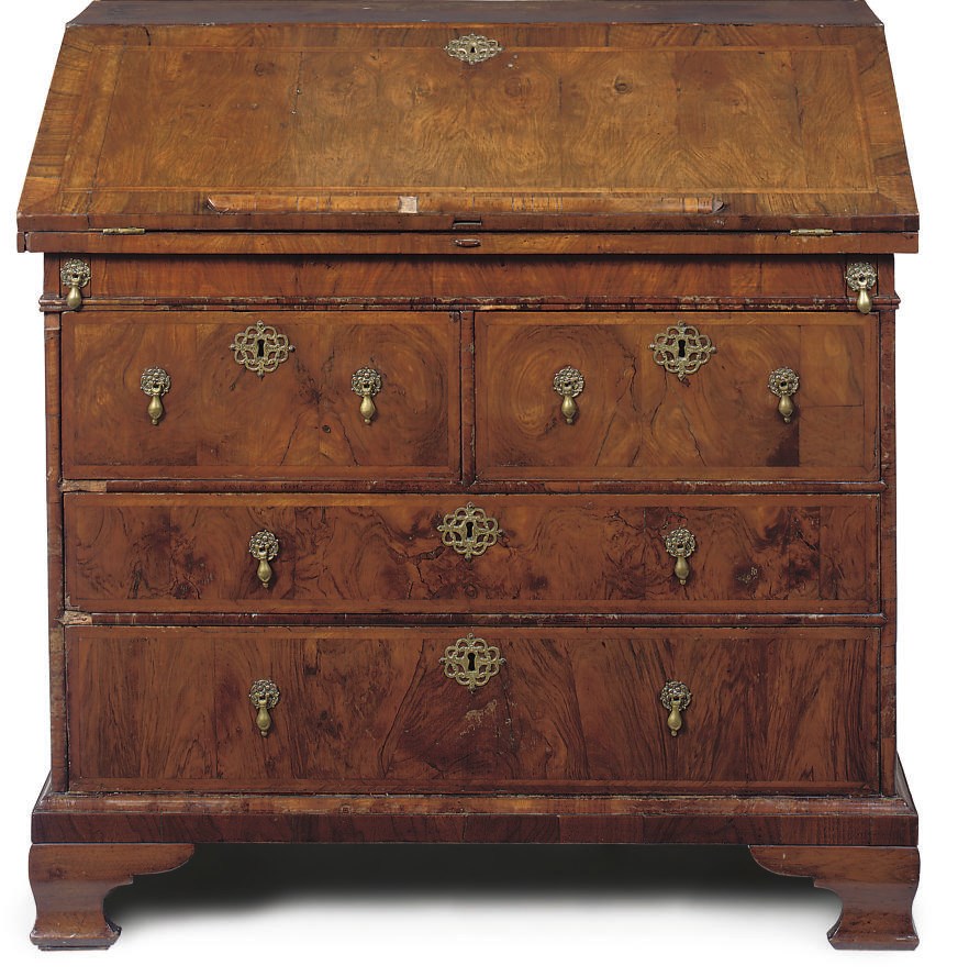 A WALNUT AND FEATHER-BANDED BUREAU