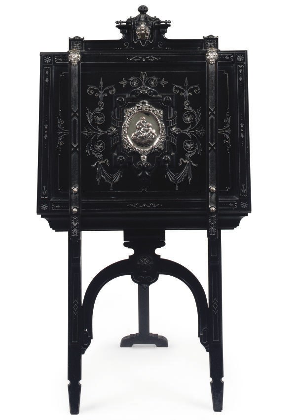 A GERMAN EBONISED AND SILVER-PLATE MOUNTED FOLIO STAND
