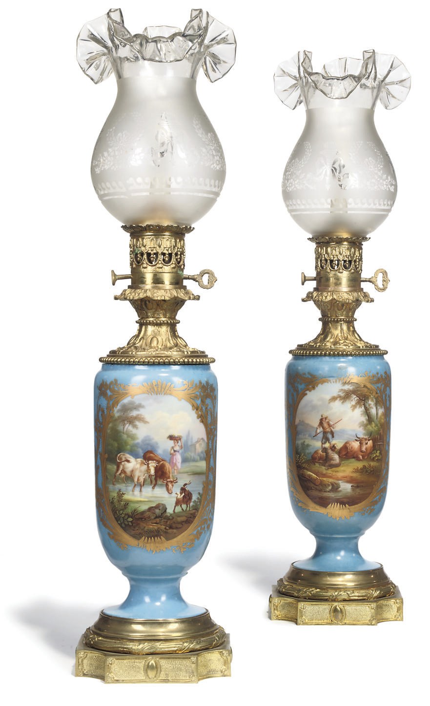 A PAIR OF FRENCH GILT BRONZE MOUNTED PORCELAIN TABLE LAMPS