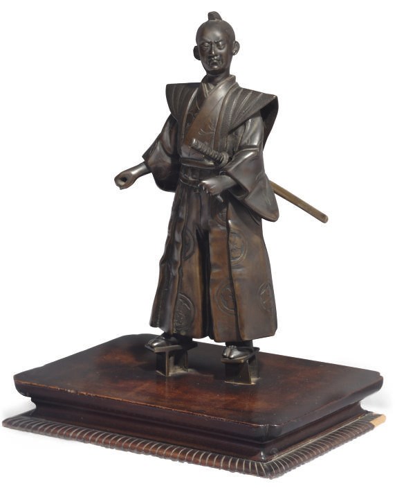 A Japanese bronze figure of a Samurai