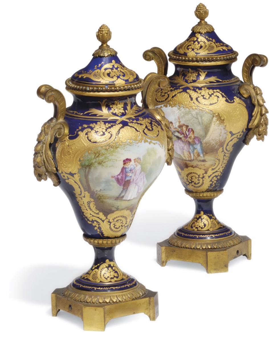 A PAIR OF SEVRES STYLE GILT-METAL-MOUNTED VASES AND COVERS