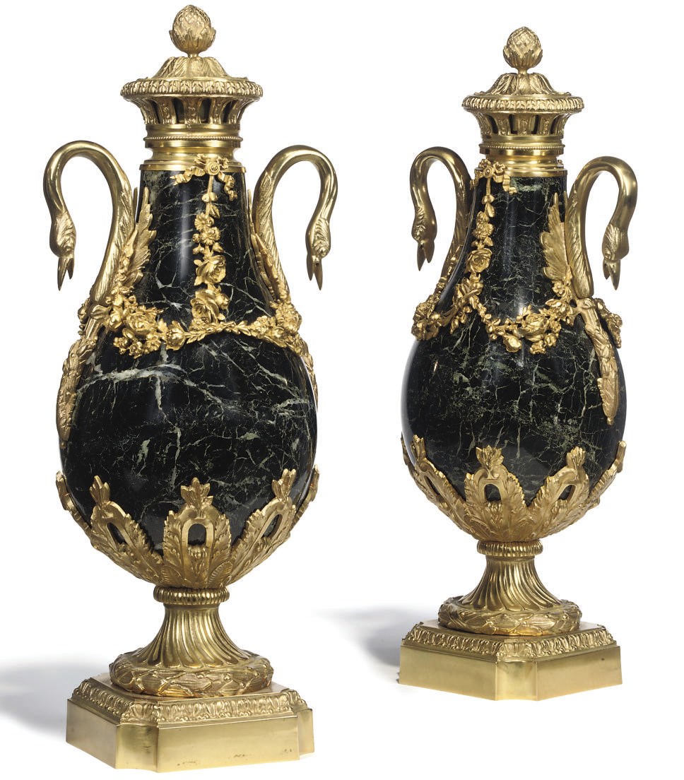 A PAIR OF GILT BRONZE MOUNTED VERDE ANTICO MARBLE URNS