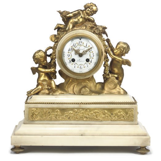 A WHITE MARBLE AND GILT BRONZE MANTEL CLOCK