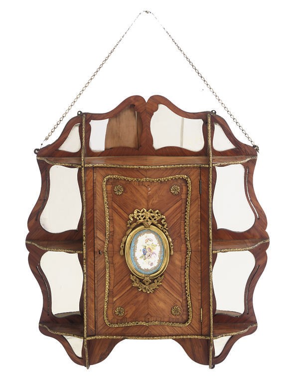 A NAPOLEON III GILT METAL MOUNTED KINGWOOD HANGING CABINET