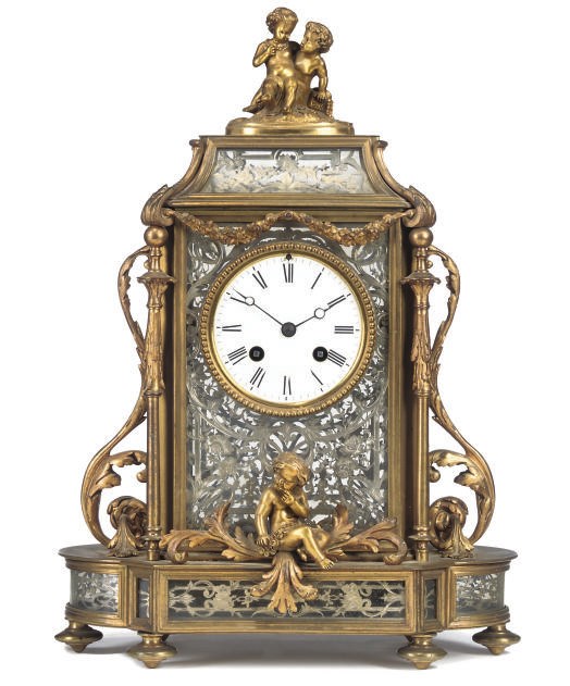A FRENCH GILT-BRASS AND SILVER-PLATED MANTEL CLOCK