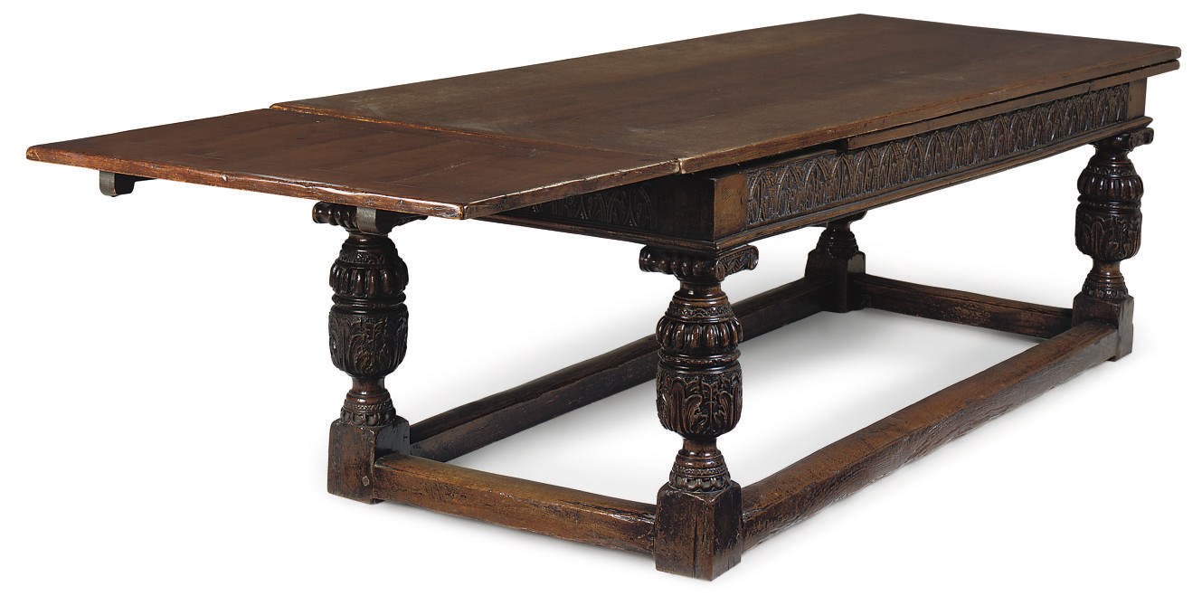 AN ENGLSIH CARVED OAK DRAW-LEAF TABLE