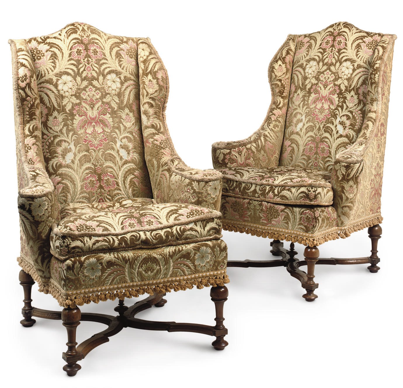 A PAIR OF VICTORIAN WALNUT WING ARMCHAIRS