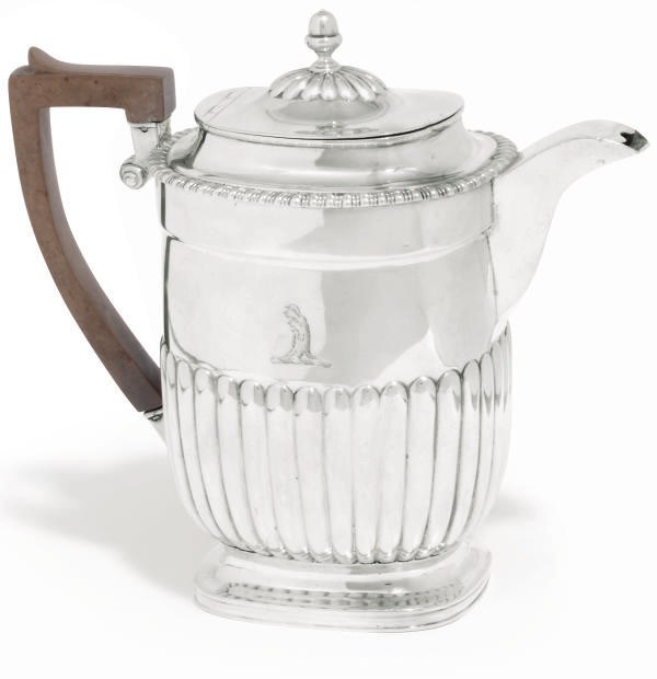 A GEORGE III SILVER HOT WATER JUG
