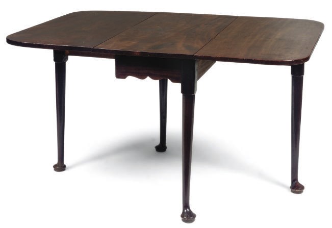A GEORGE II MAHOGANY DROP-LEAF TABLE