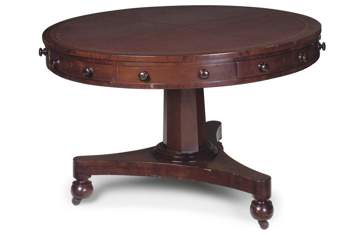 AN EARLY VICTORIAN MAHOGANY DRUM LIBRARY TABLE