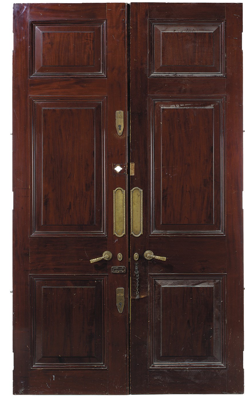 A PAIR OF VICTORIAN PANELLED MAHOGANY DOORS