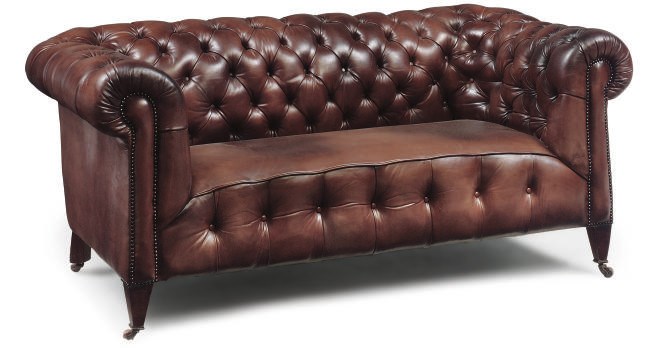 A VICTORIAN LEATHER UPHOLSTERED CHESTERFIELD SOFA