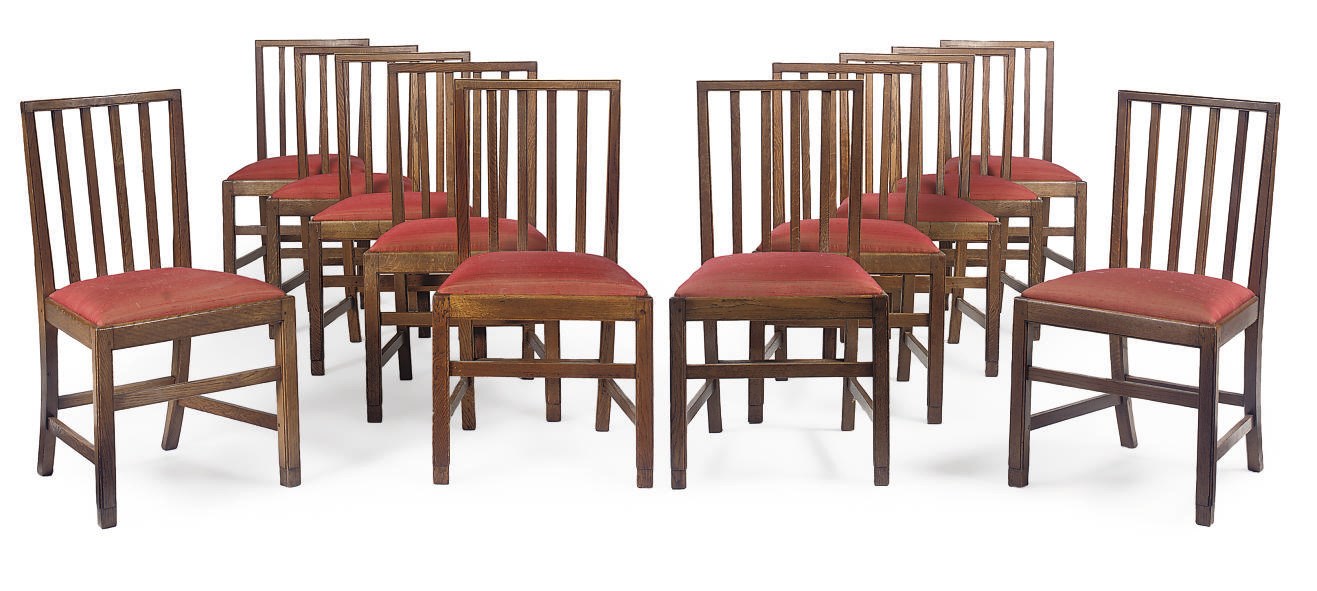 A SET OF TWELVE OAK DINING CHAIRS