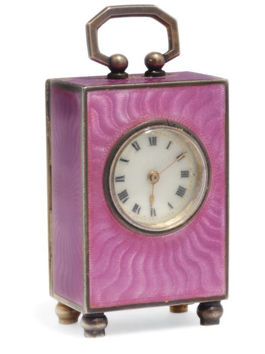 A CONTINENTAL MINIATURE SILVER GILT AND ENAMEL BOUDOIR CLOCK