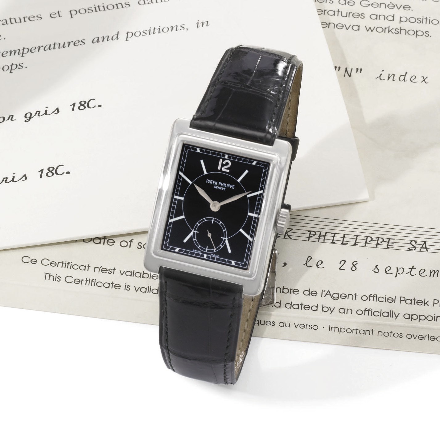 Patek Philippe. An 18K white gold rectangular wristwatch with black dial
