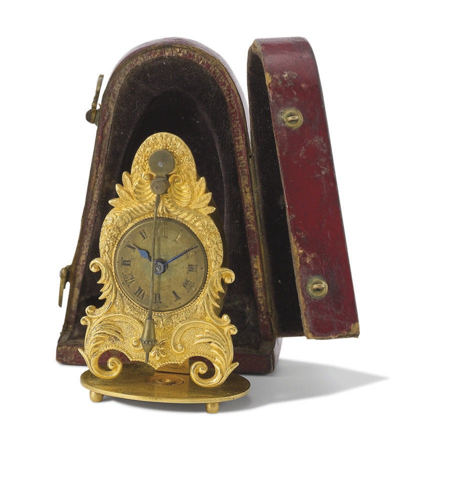 Anon. An unusual gilt bronze miniature zappler clock with fitted box