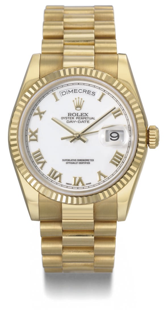 Rolex. An 18K gold self-winding water-resistant calendar wristwatch with sweep centre seconds and bracelet