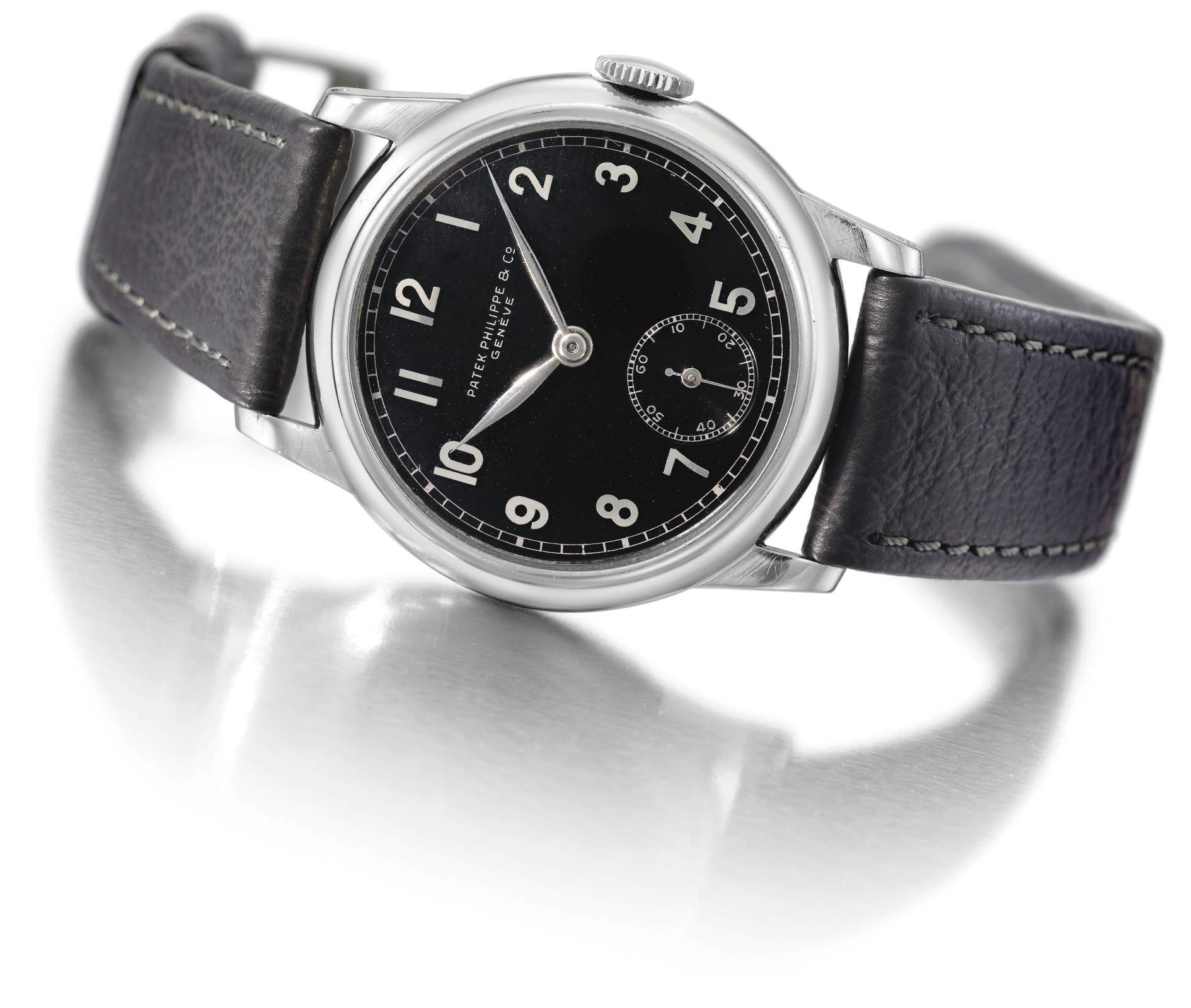 Patek Philippe. A fine, rare and unusual stainless steel wristwatch with black dial
