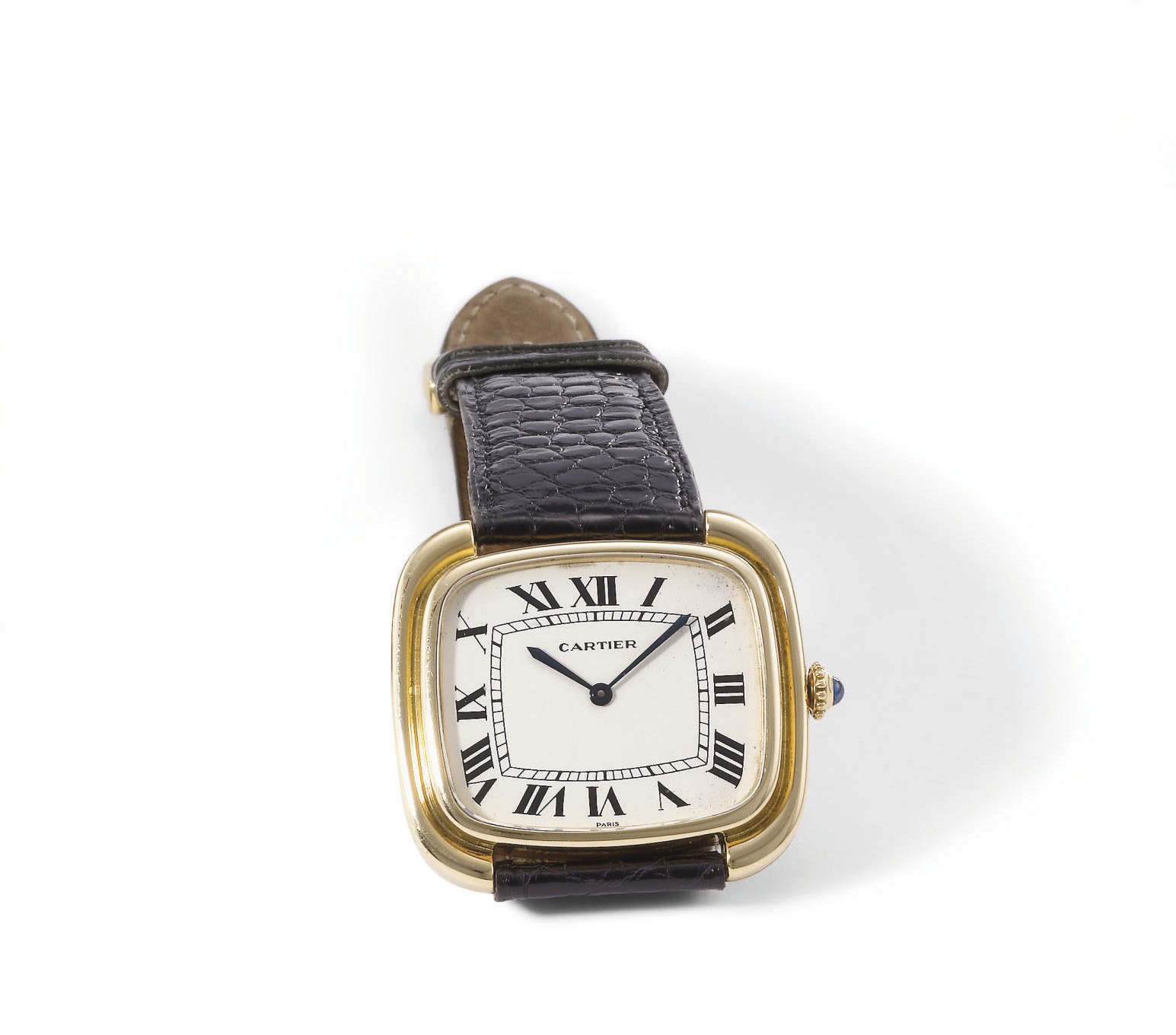 Cartier. An unusual and large 18K gold cushion-shaped wristwatch