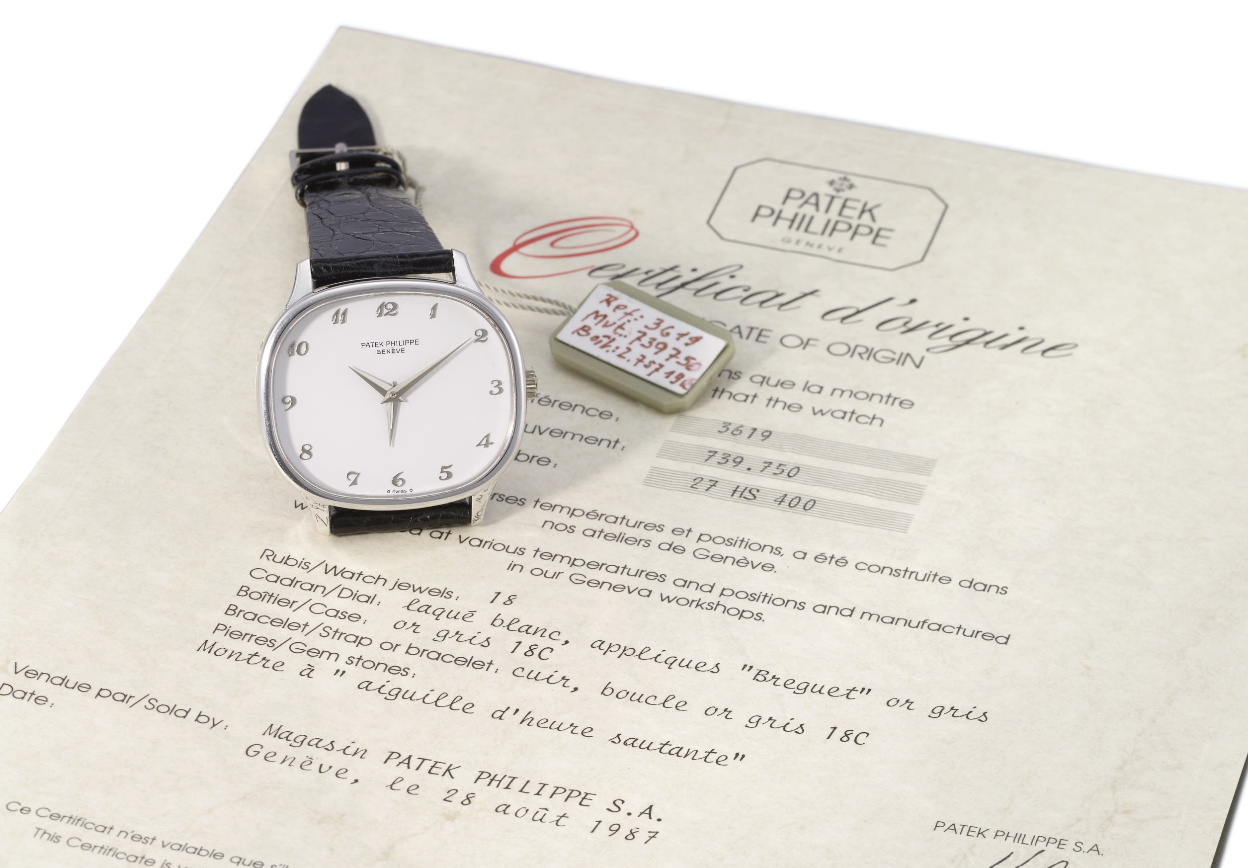 Patek Philippe. A very fine, rare and unique 18K white gold cushion-shaped two time zone wristwatch with white lacquer dial and applied white gold Breguet numerals, original certificate and sales tag