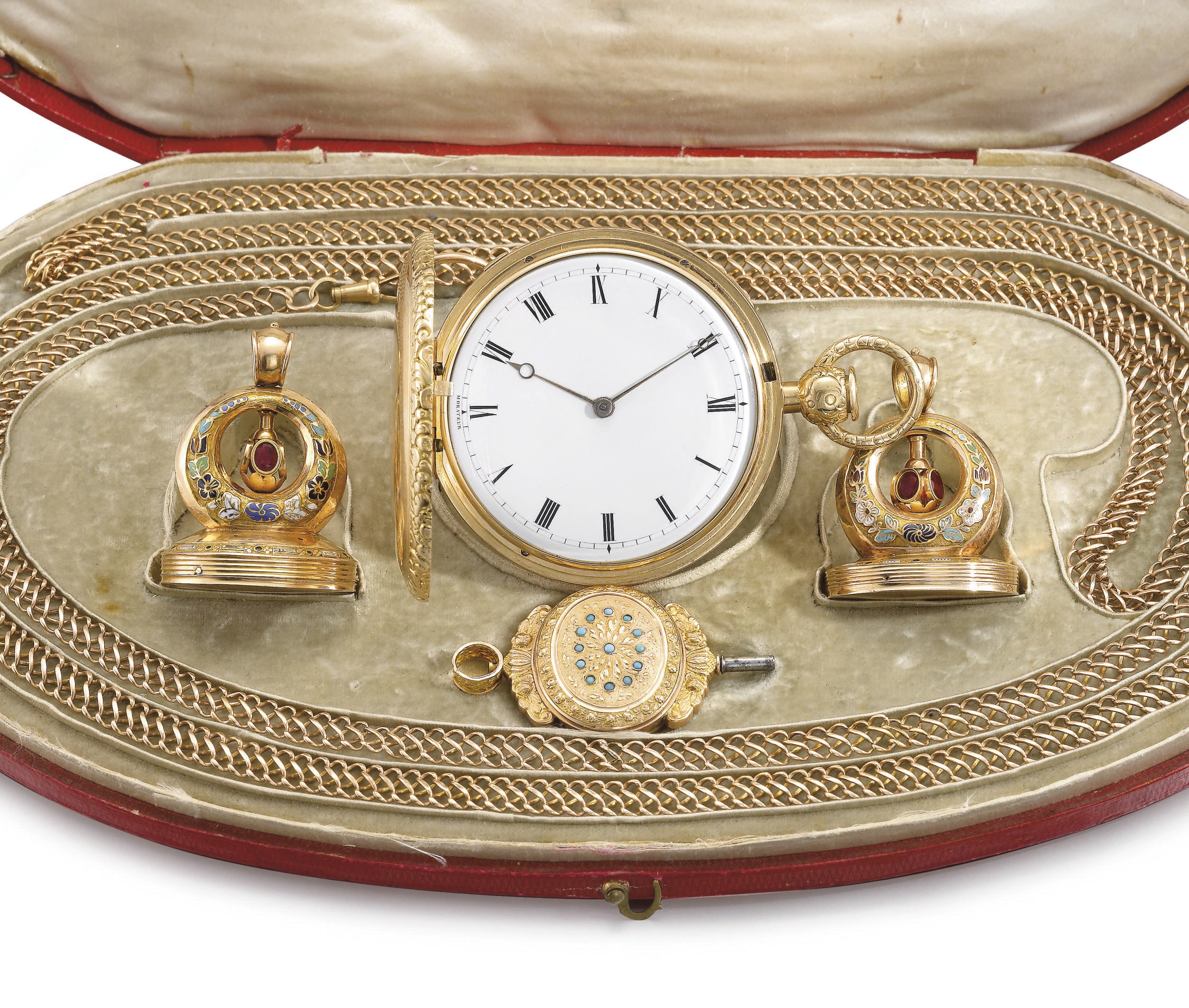 Foucaud. A fine and unusual set comprising an 18K gold hunter case two-train quarter repeating keyless lever musical watch, two 18K gold, enamel and garnet-set musical seals, one 18K gold and turquoise-set musical key, a gold chain and original fitted box