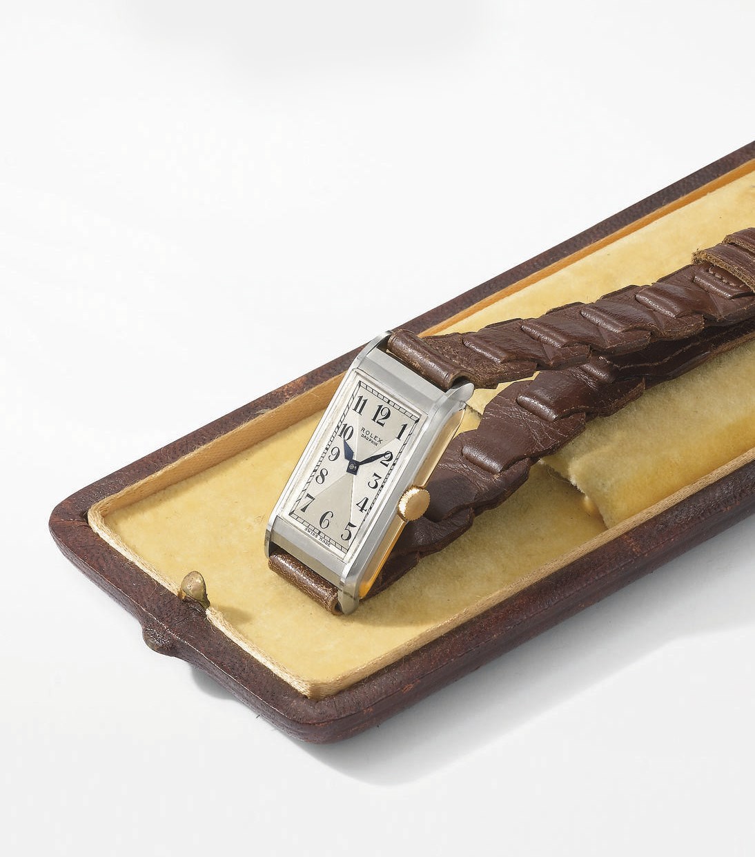 Rolex. A rare and unusual 18K white and pink gold rectangular wristwatch with two-tone silvered dial, original buckle and box