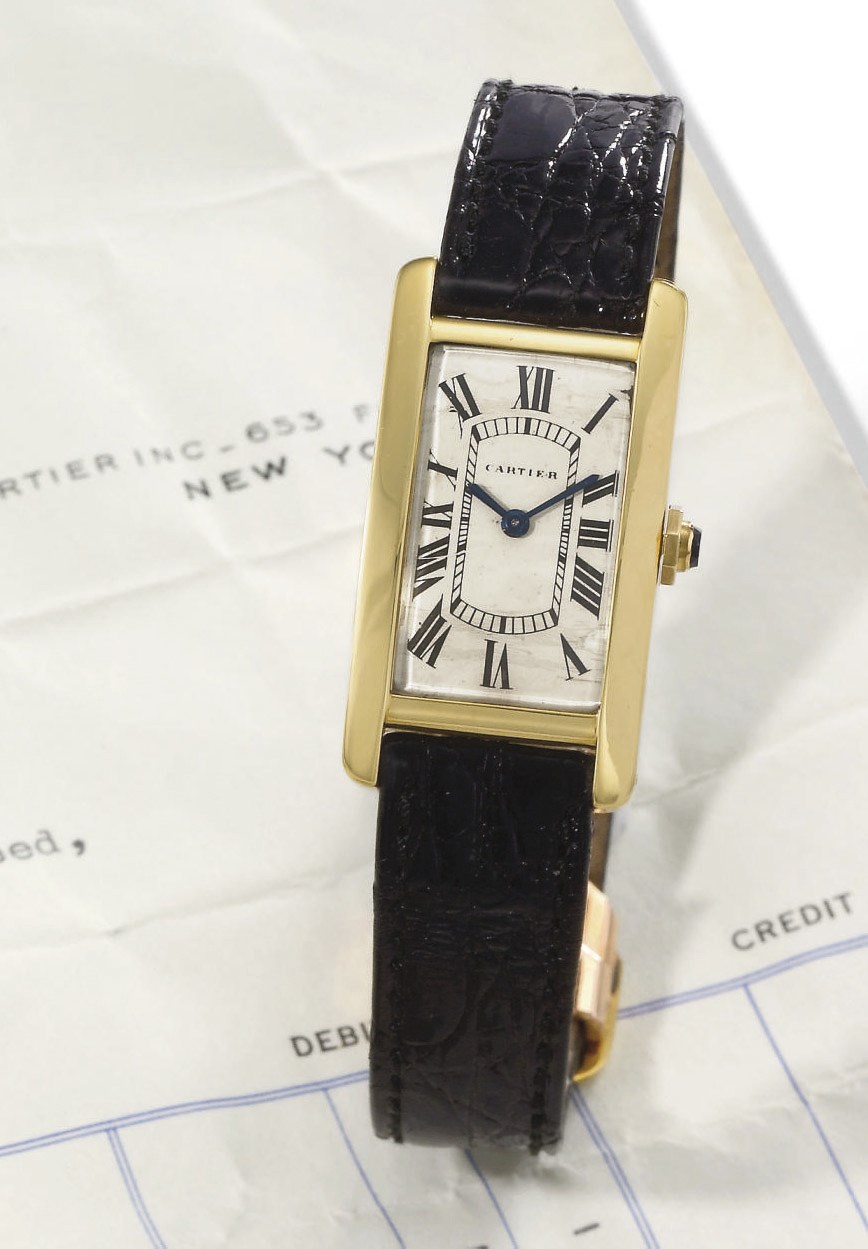 Cartier. A fine 18K gold rectangular curved wristwatch