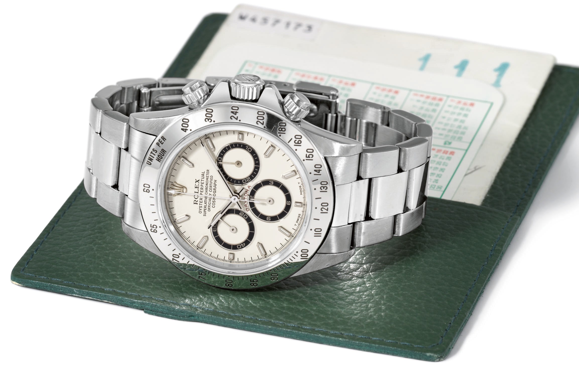 Rolex. A rare and attractive stainless steel self-winding water-resistant chronograph wristwatch with cream-coloured dial, bracelet and guarantee