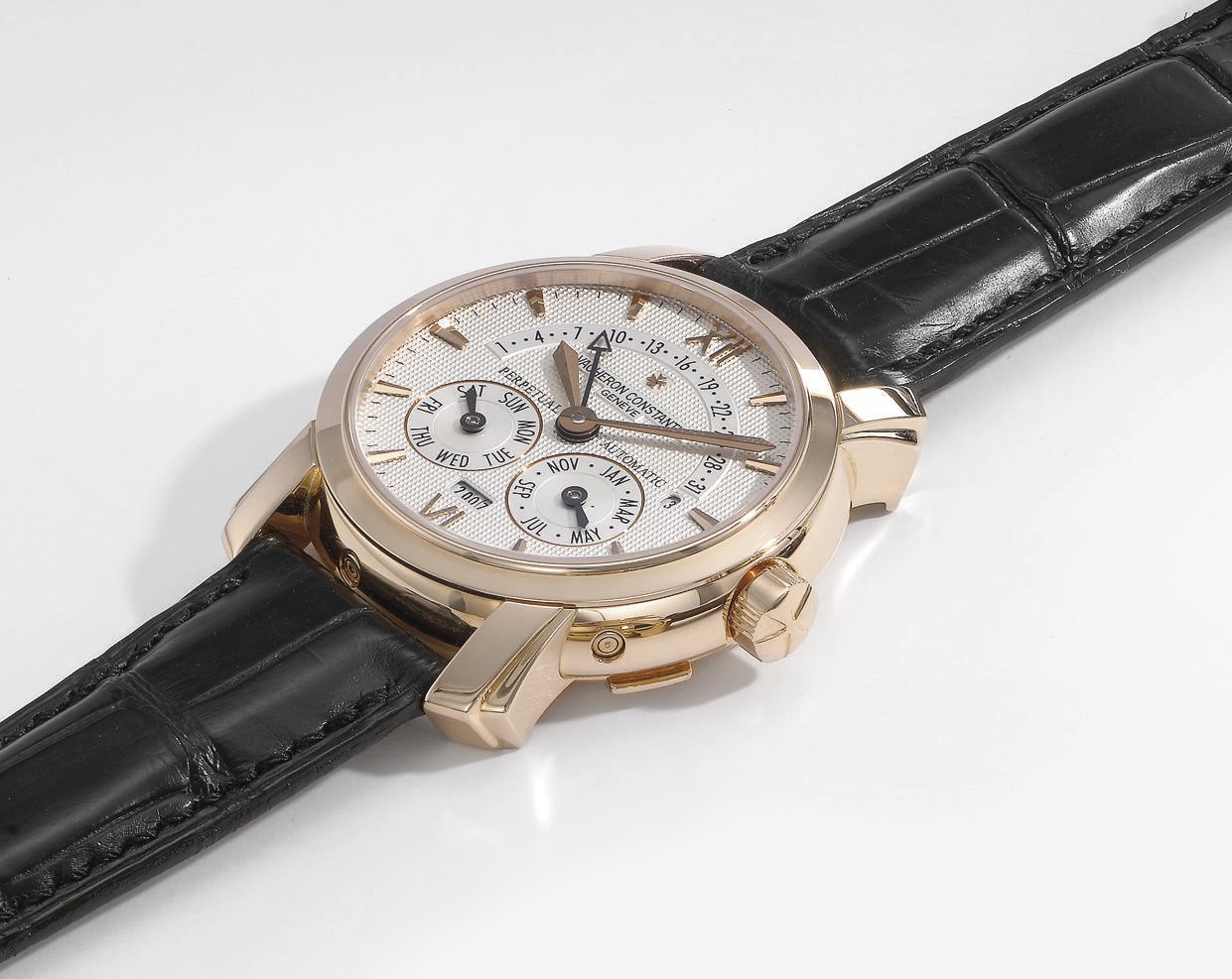Vacheron Constantin. A very fine 18K pink gold self-winding perpetual calendar hinged wristwatch with year indication and retrograde date